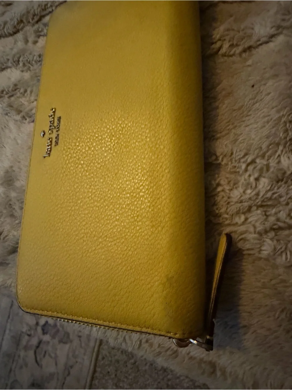 kate spade pebbled yellow zip-around wallet